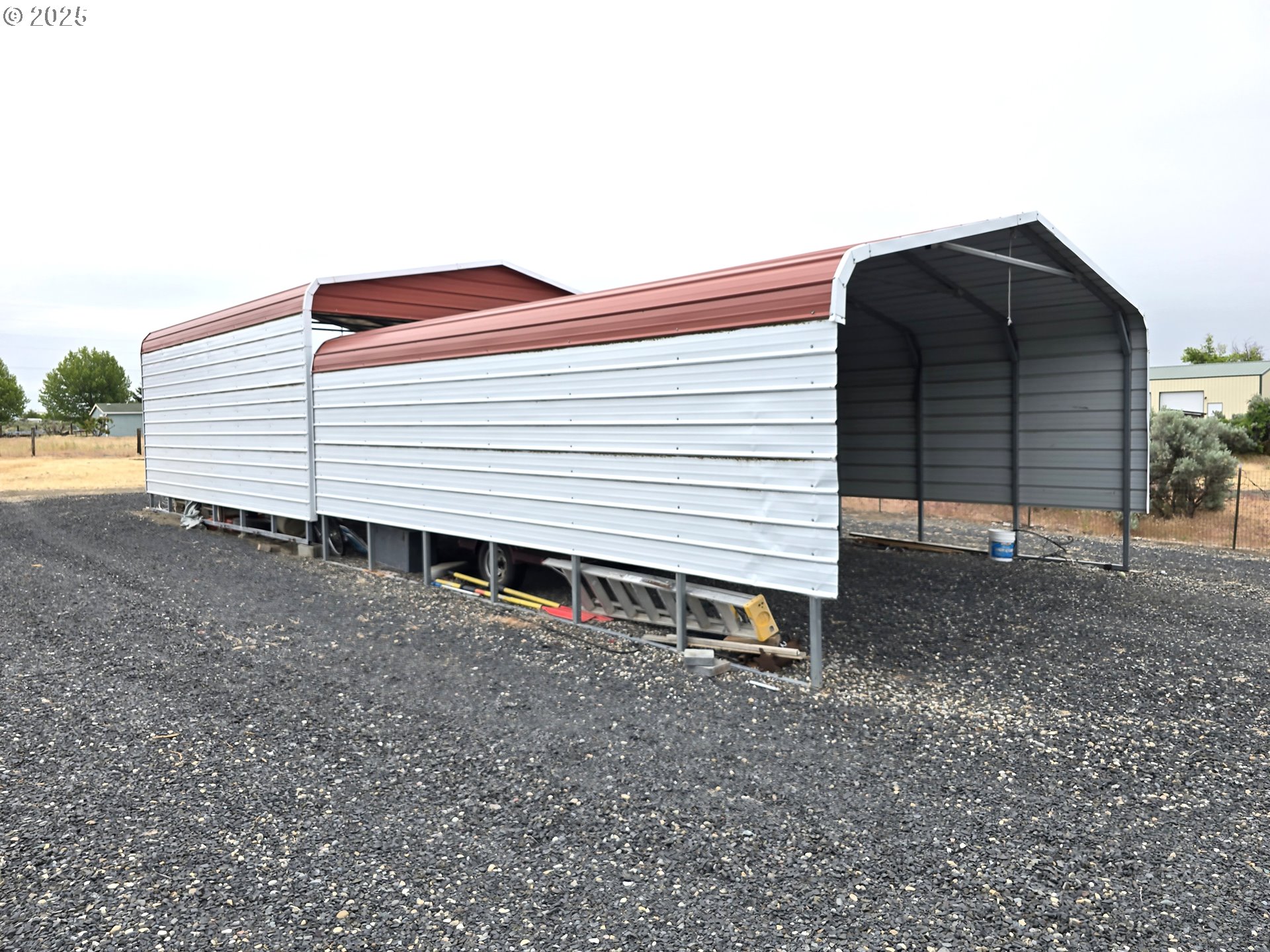 80393 Zimmer Lane Hermiston, OR 97838 - Photo 44 of 46 a view of a house with a backyard
