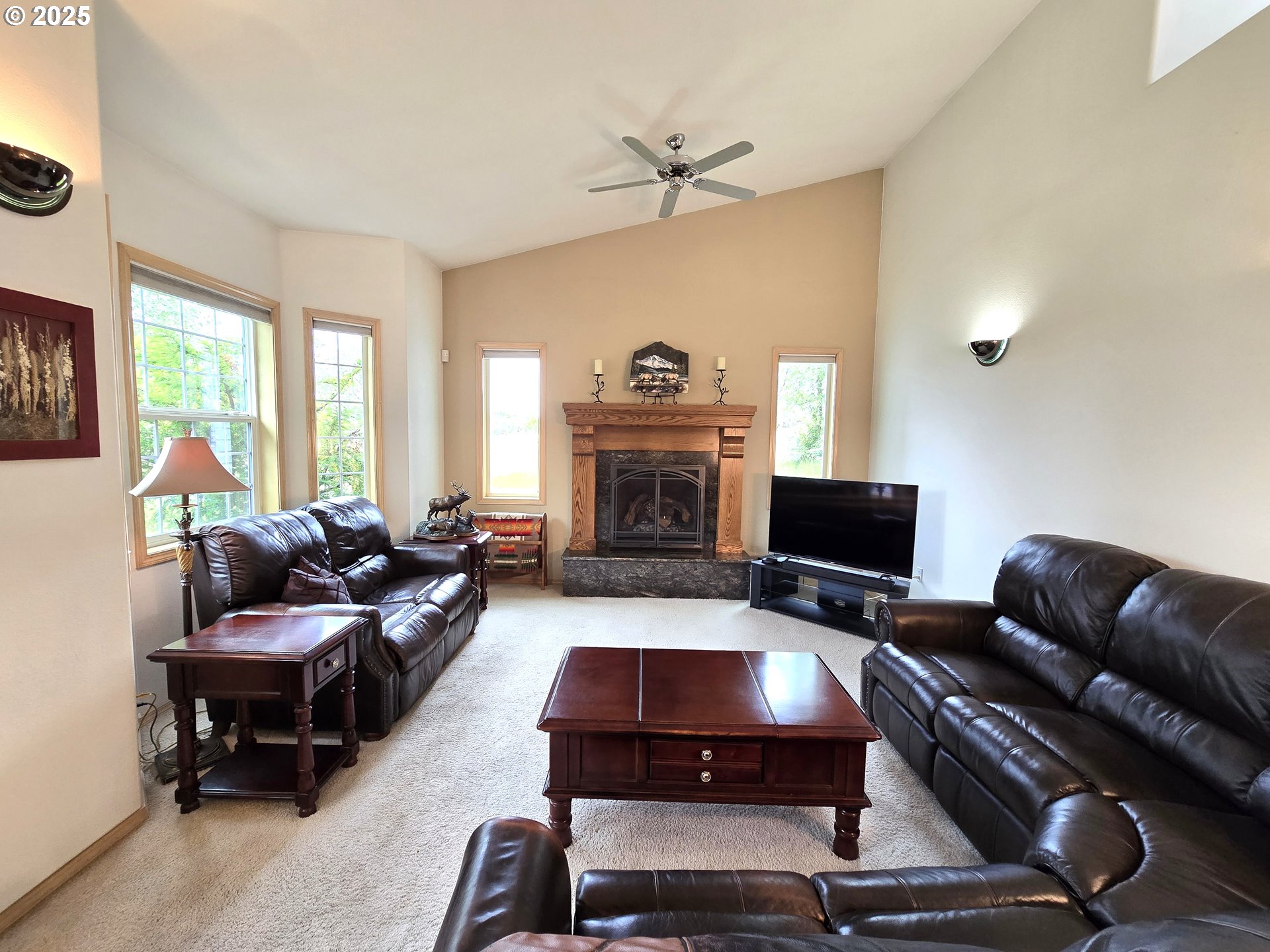80393 Zimmer Lane Hermiston, OR 97838 - Photo 7 of 46 a living room with furniture and a fireplace