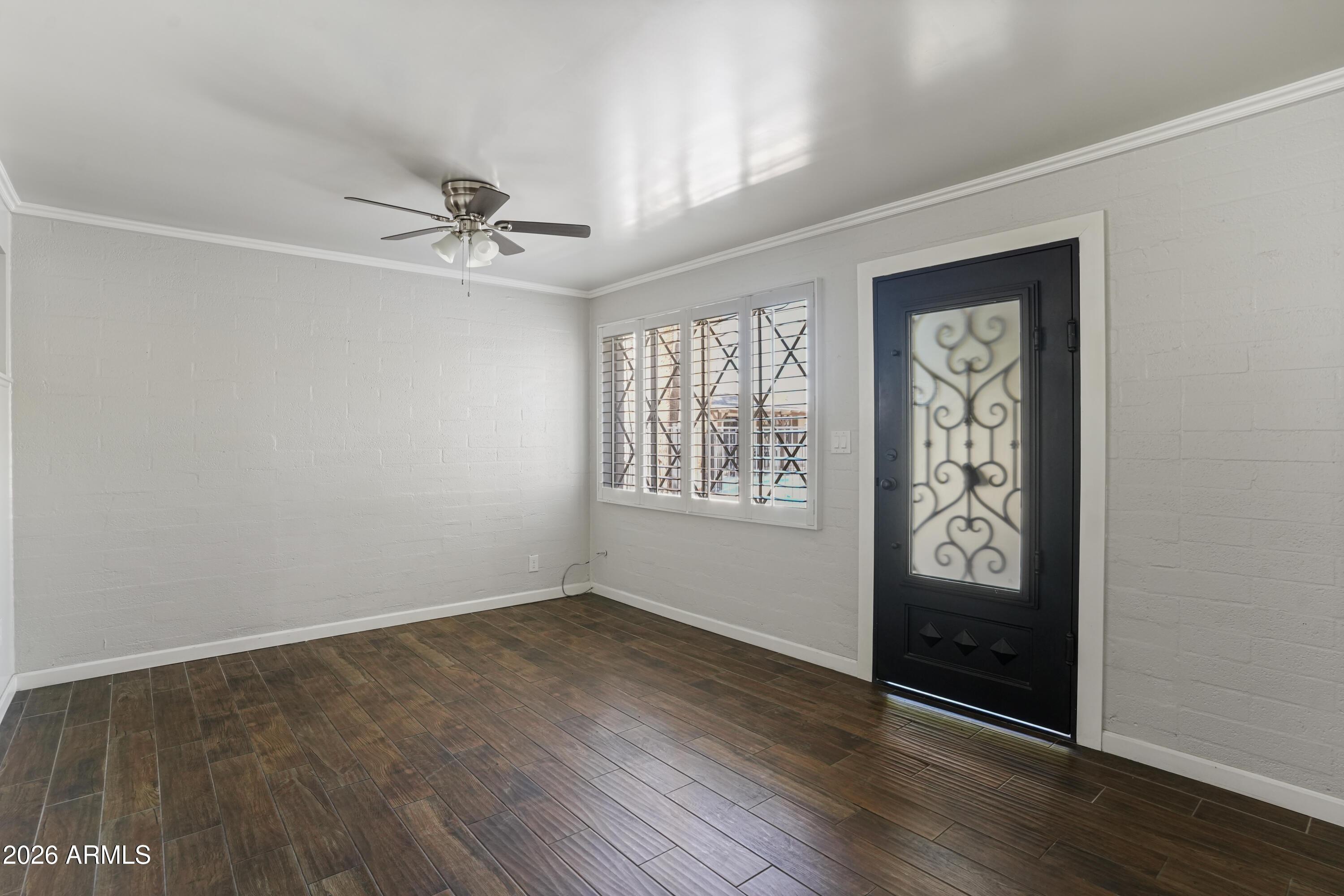 3426 North Miller Road, Unit 8 Scottsdale, AZ 85251 - Photo 3 of 10 wooden floor in an empty room with a window