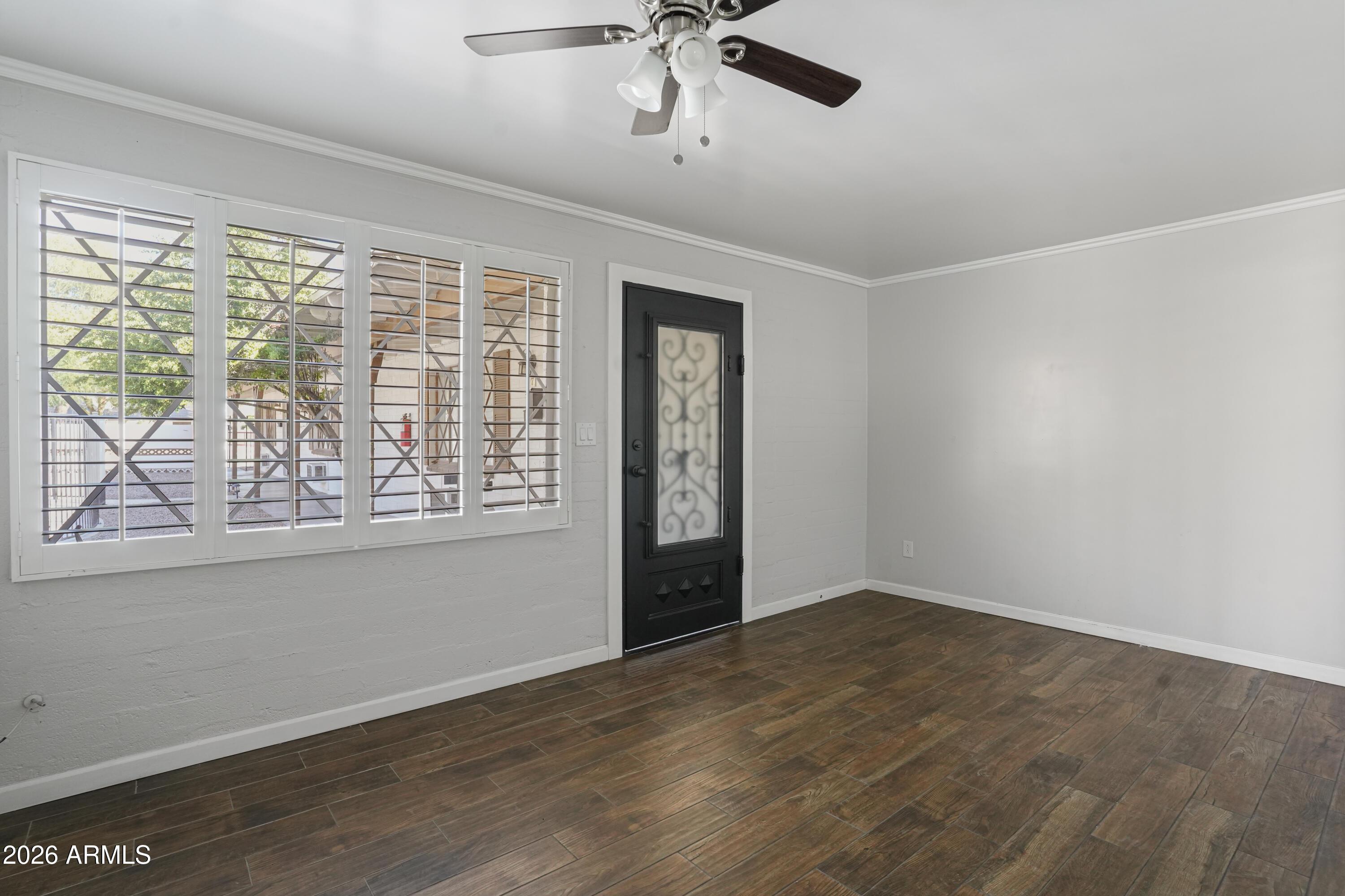 3426 North Miller Road, Unit 8 Scottsdale, AZ 85251 - Photo 4 of 10 a view of an empty room with a window