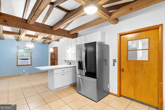 a kitchen with stainless steel appliances a refrigerator and a stove