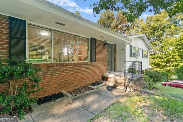 a view of a yard with an outdoor seating