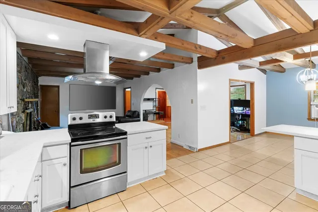 a kitchen with a stove and a refrigerator