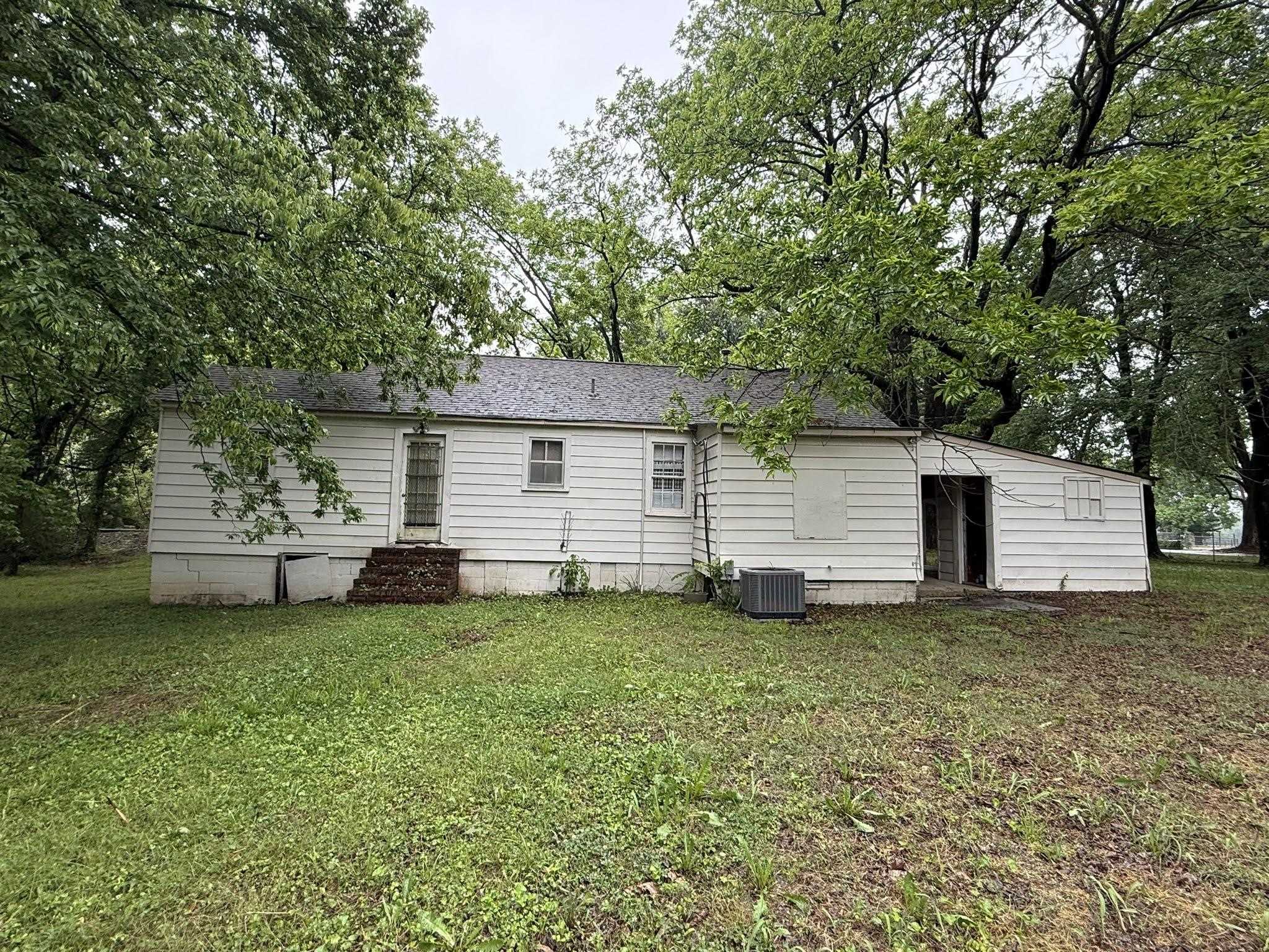 8488 Quito Road Millington, TN 38053 - Photo 29 of 30 a view of a backyard with a garden
