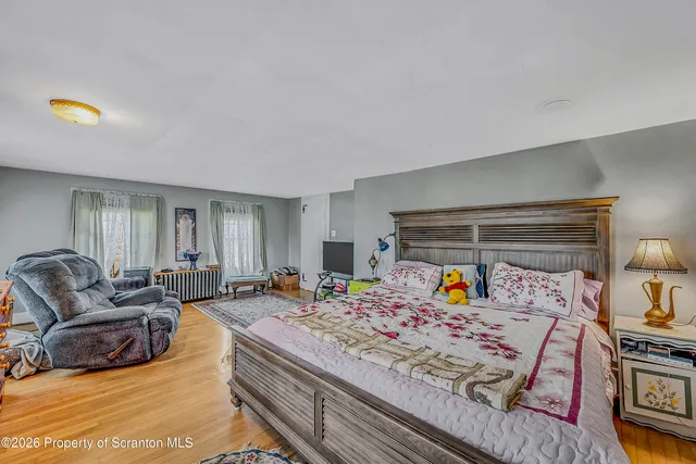 a room with lots of books and plants