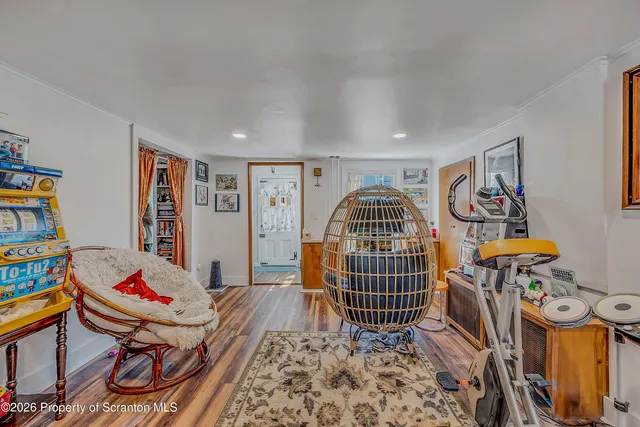 a living room with lots of furniture and baby walls