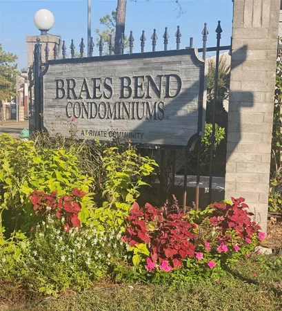 a street sign that is in front of flowers