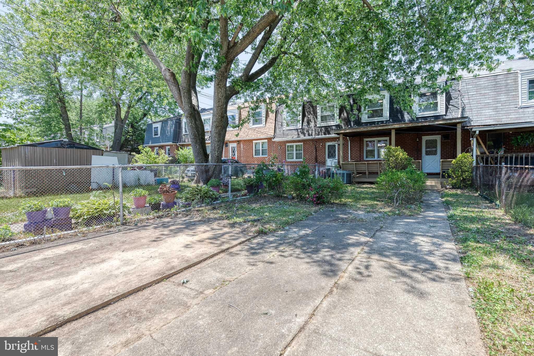 5649 Utrecht Road Baltimore, MD 21206 - Photo 41 of 42 a view of a house with a yard and hanging chair