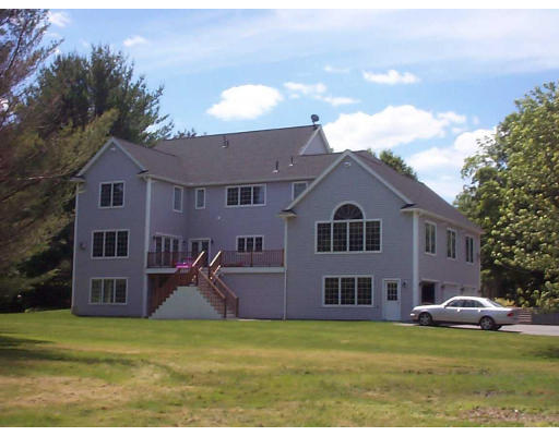 2 Hillcrest Road Bedford, MA 01730 - Photo 3 of 3 a view of a big house with a big yard and potted plants