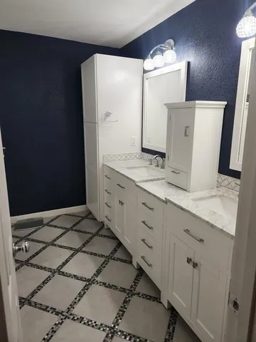 a view of a two chairs in the balcony