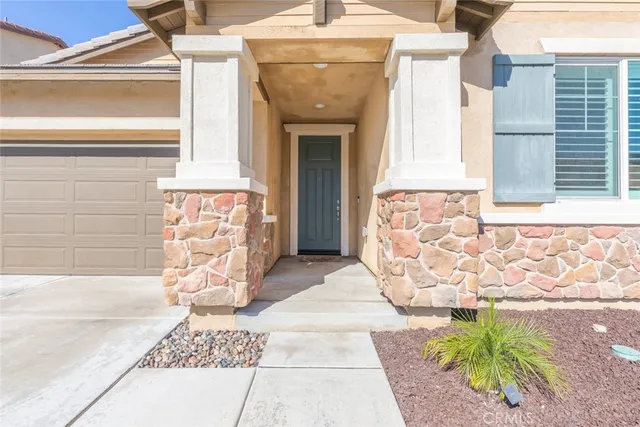 a front view of a house with a garage
