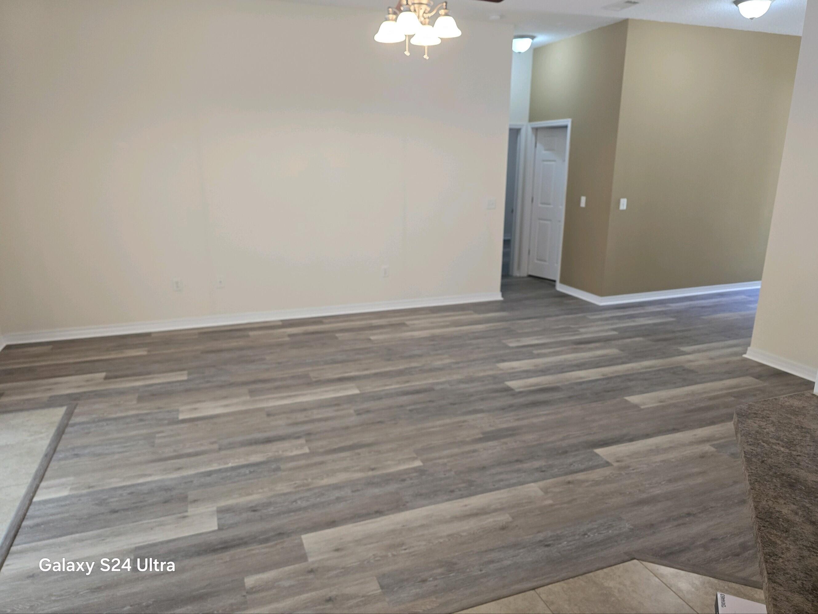 2864 Soles Lane Crestview, FL 32539 - Photo 11 of 32 a view of a livingroom with wooden floor