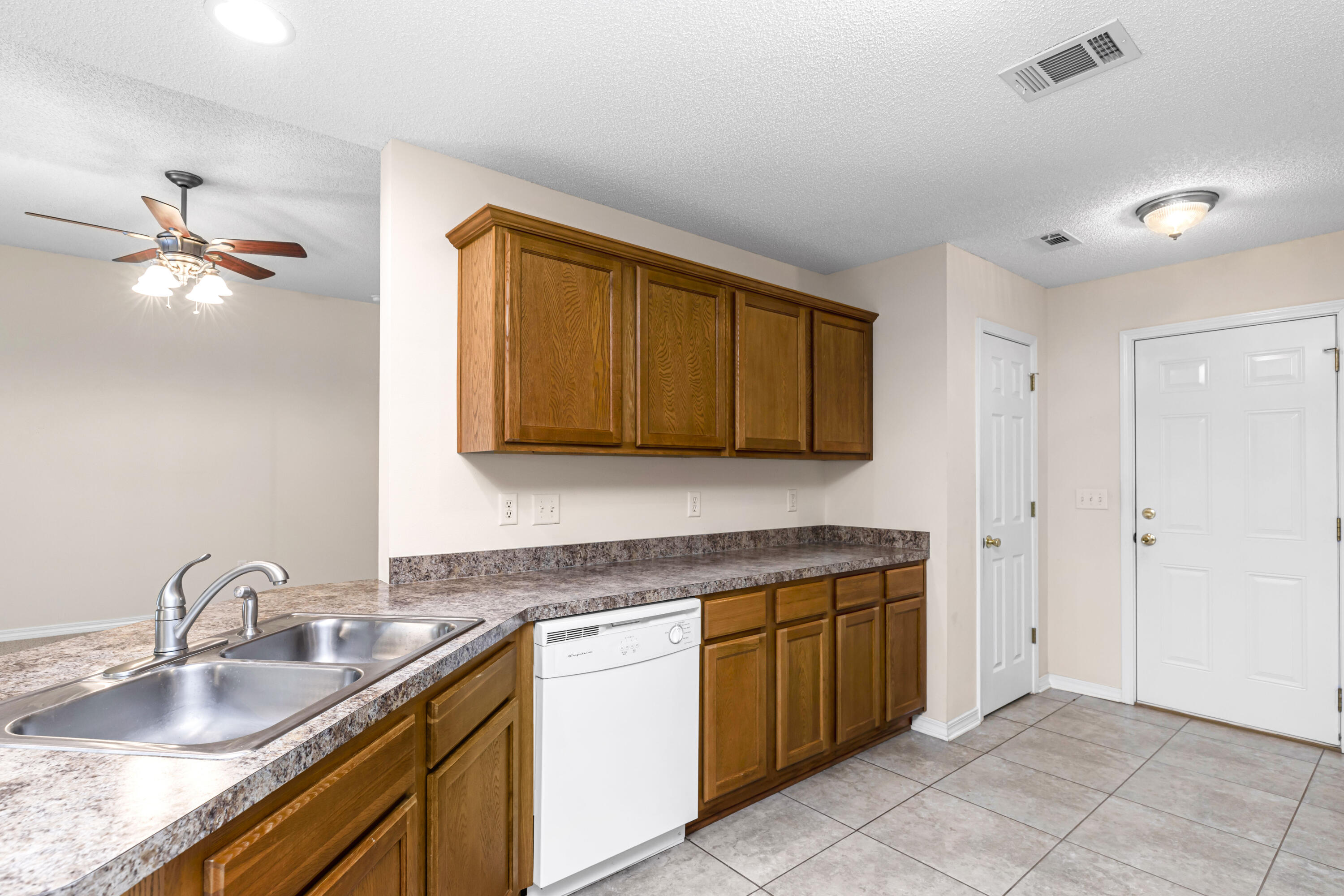 2864 Soles Lane Crestview, FL 32539 - Photo 15 of 32 a kitchen with a sink cabinets and appliances
