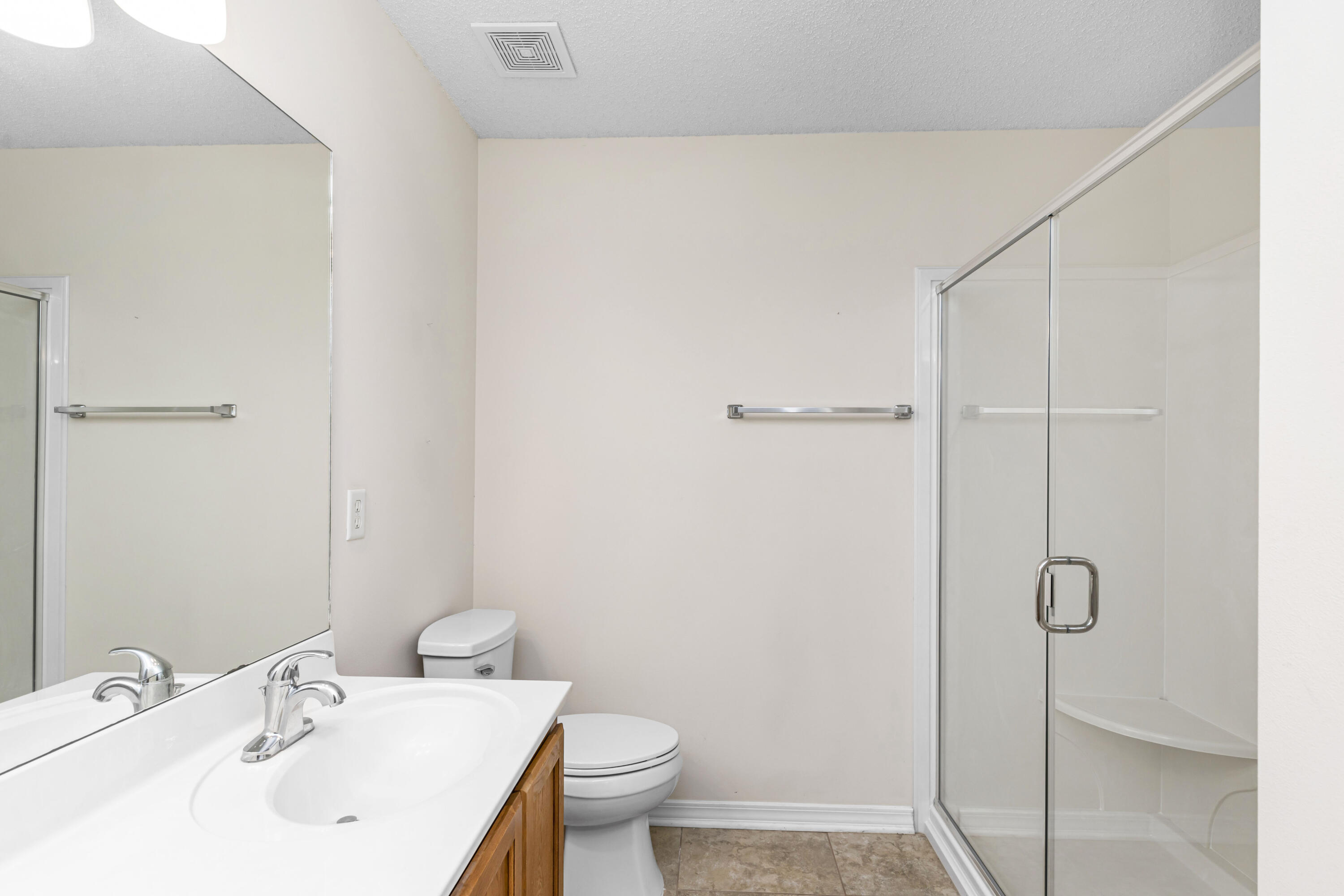2864 Soles Lane Crestview, FL 32539 - Photo 25 of 32 a bathroom with a sink a toilet and shower
