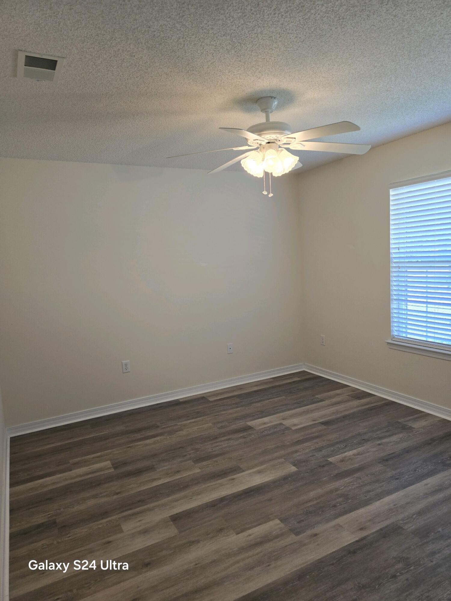 2864 Soles Lane Crestview, FL 32539 - Photo 28 of 32 a view of empty room with wooden floor