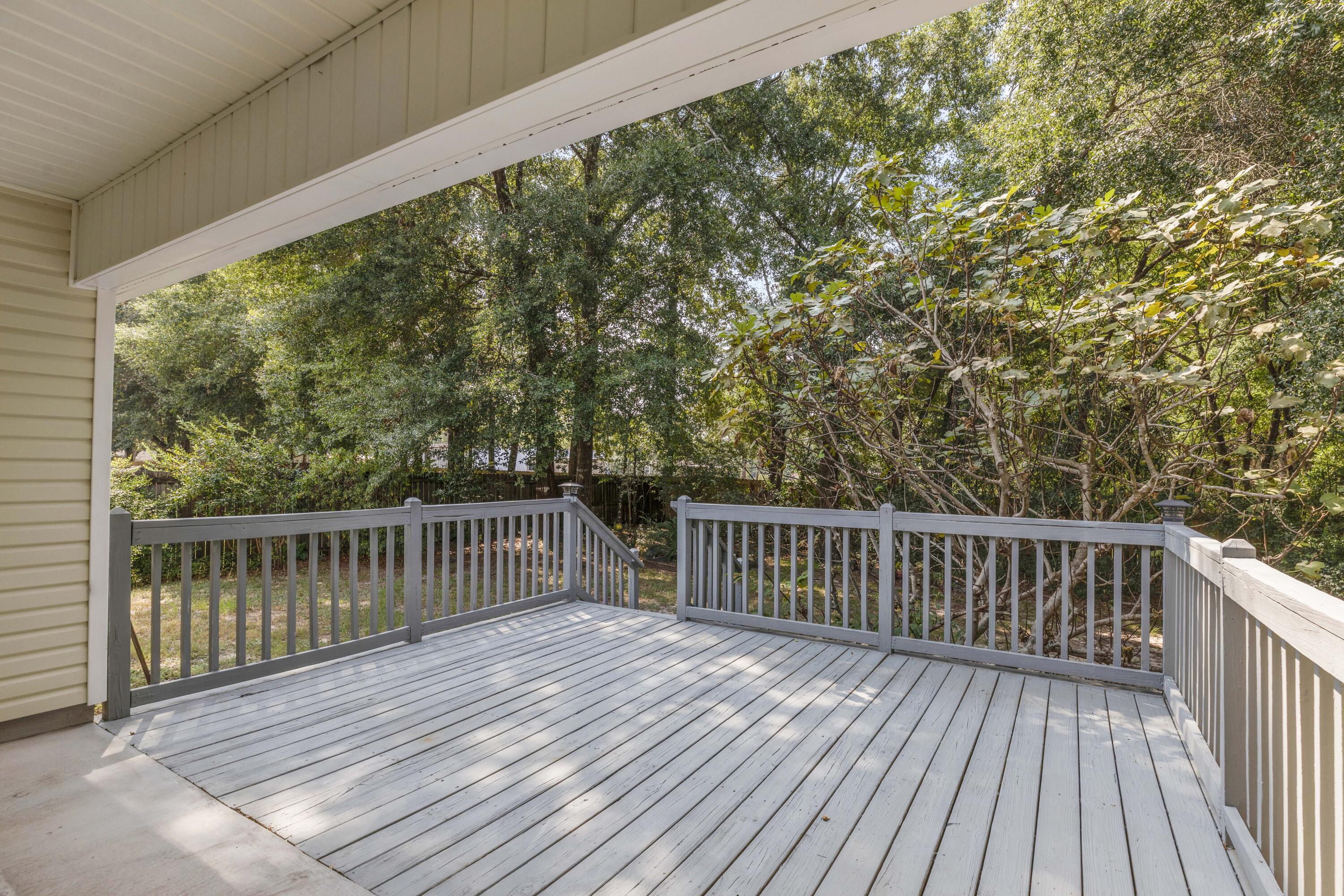 2864 Soles Lane Crestview, FL 32539 - Photo 29 of 32 a balcony with wooden floor and fence