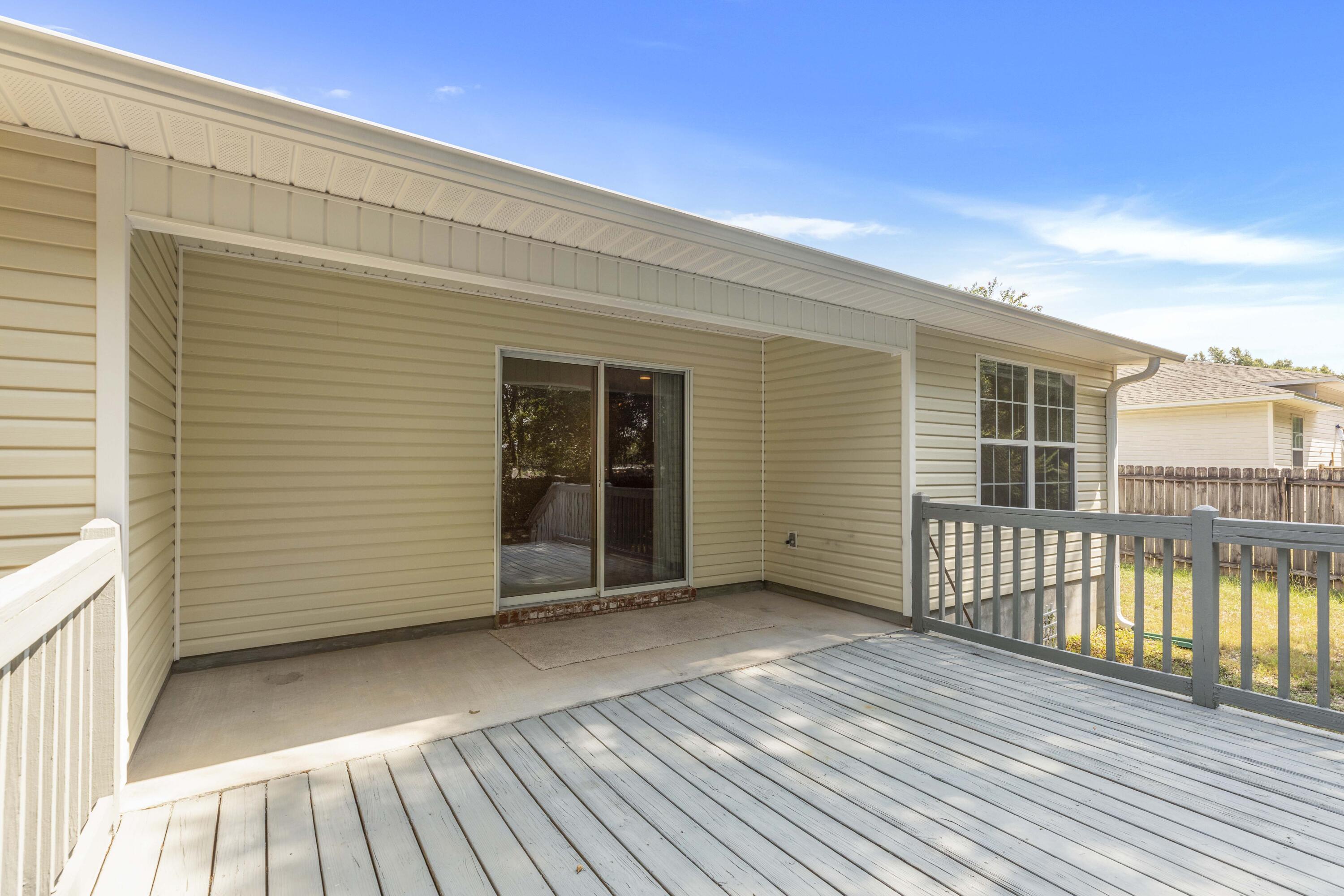 2864 Soles Lane Crestview, FL 32539 - Photo 30 of 32 a view of a balcony with a barbeque