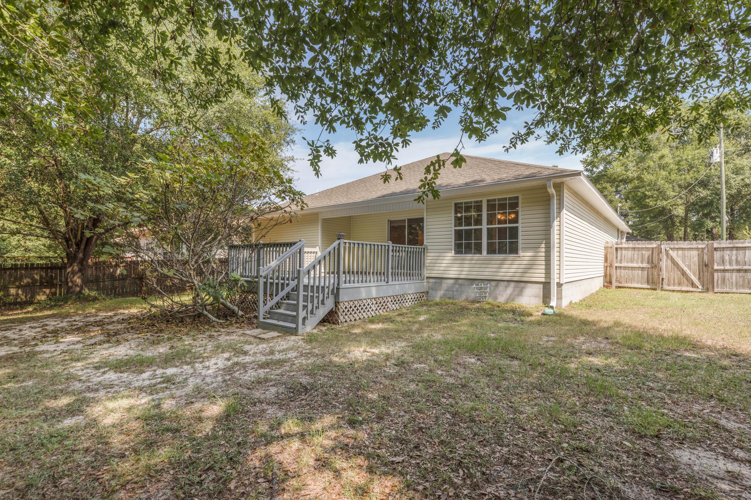 2864 Soles Lane Crestview, FL 32539 - Photo 5 of 32 a view of a house with a yard