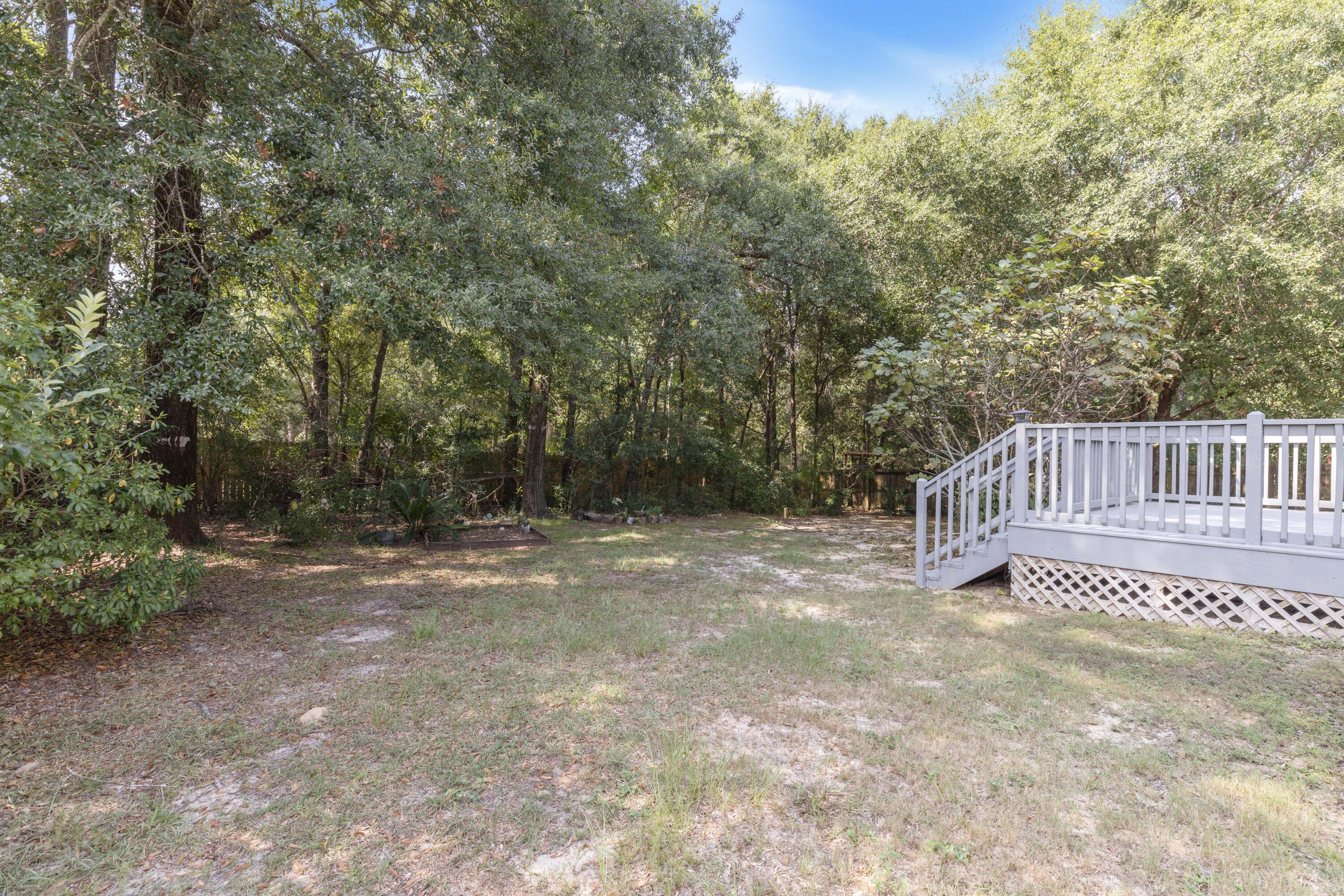 2864 Soles Lane Crestview, FL 32539 - Photo 10 of 32 a view of a backyard with a small cabin