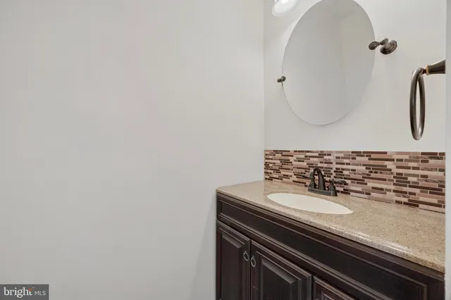 a kitchen with wooden floors and refrigerator