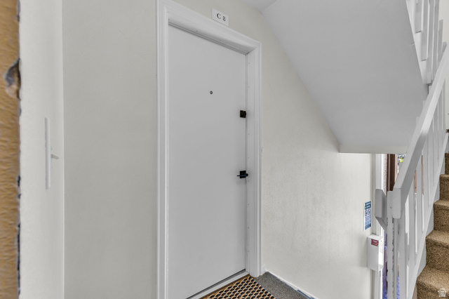 88 West 50 South, Unit C8 Centerville, UT 84014 - Photo 27 of 29 Entry door with security locks, white painted trim, and a textured welcome mat