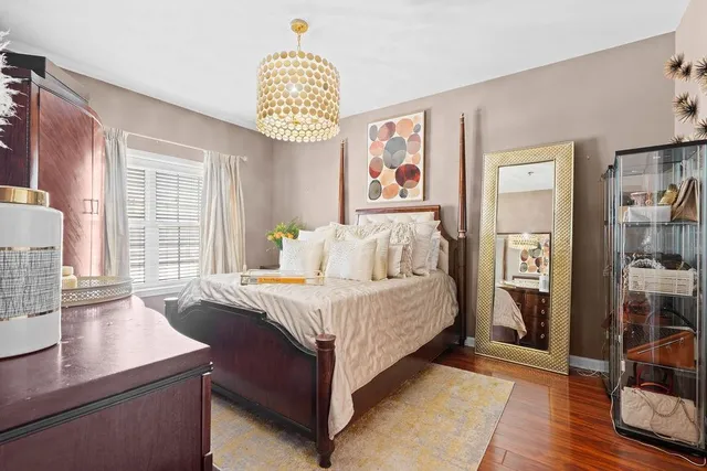 a bedroom with a bed and a table in it