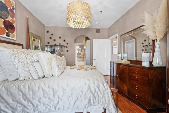 a bedroom with a bed and a dresser