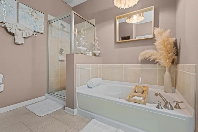 a bathroom with a tub and shower