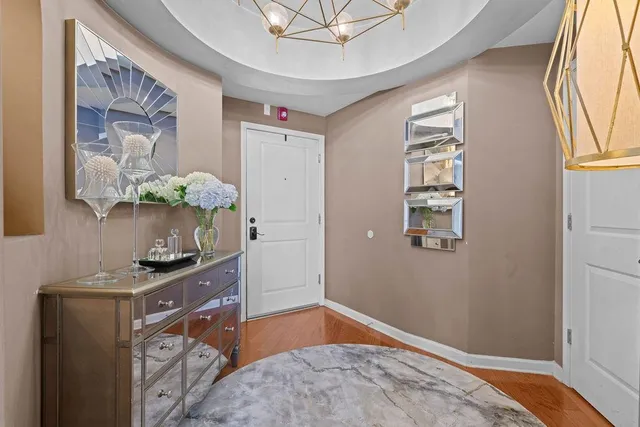 a bedroom with a bed and a dresser in it