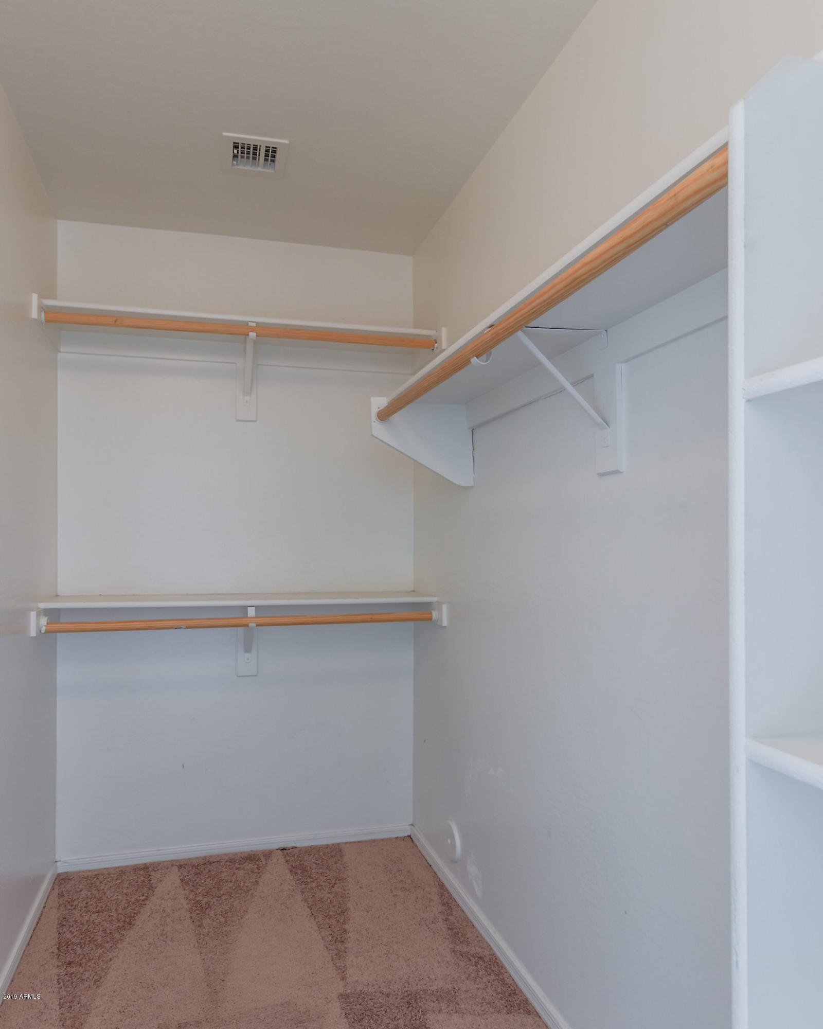 4332 West Maldonado Road Laveen, AZ 85339 - Photo 12 of 21 a view of an empty walk in closet