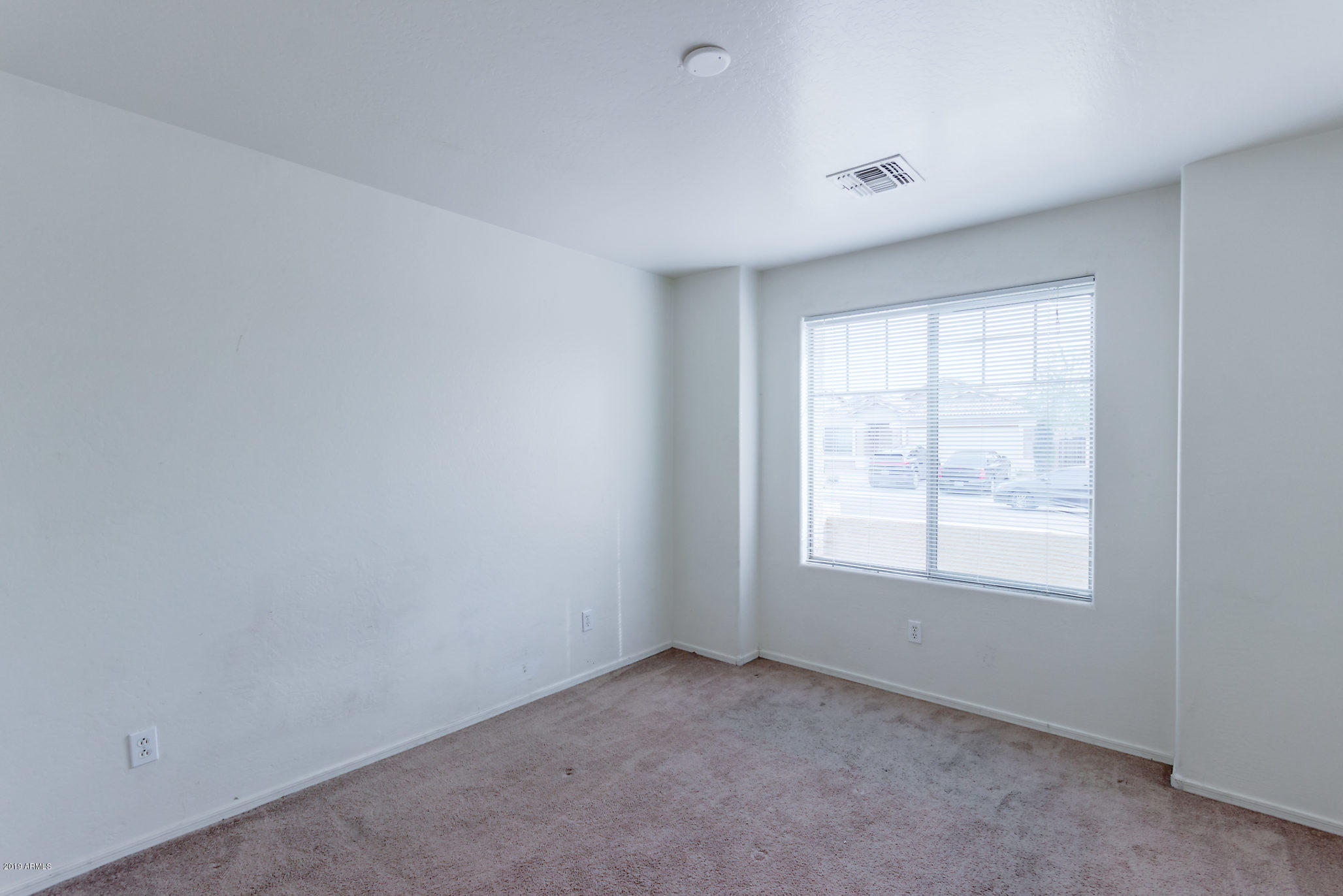 4332 West Maldonado Road Laveen, AZ 85339 - Photo 14 of 21 an empty room with a window