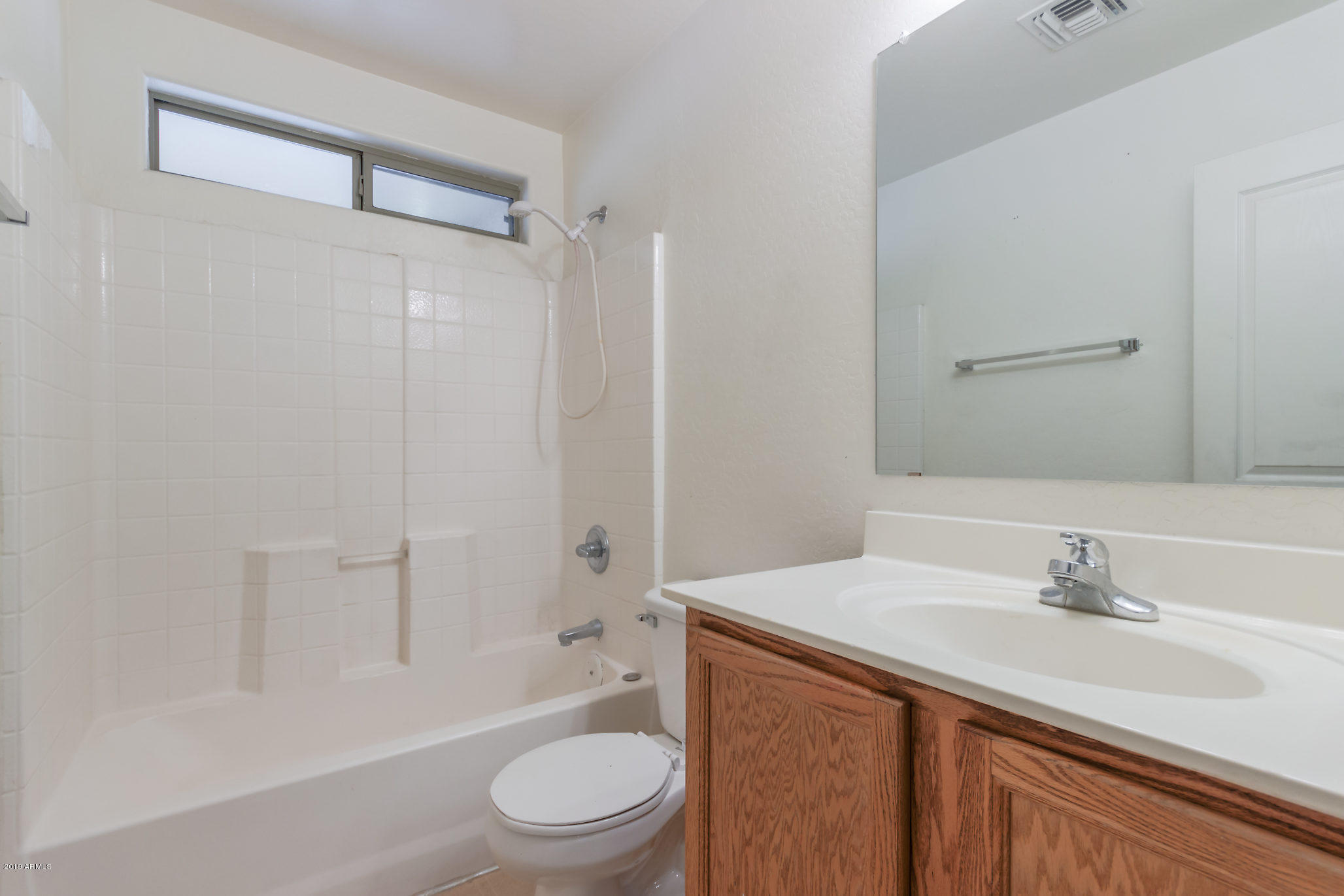 4332 West Maldonado Road Laveen, AZ 85339 - Photo 17 of 21 a bathroom with a sink a toilet and shower