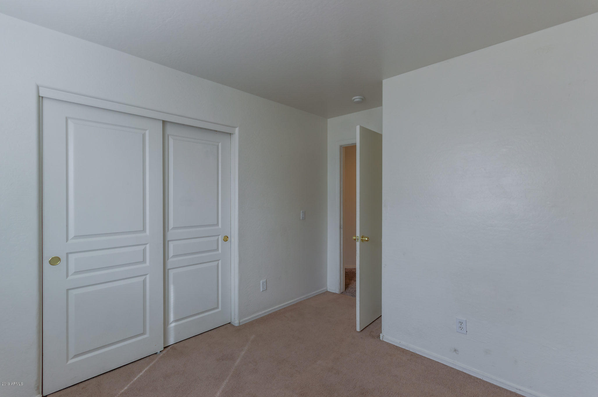 4332 West Maldonado Road Laveen, AZ 85339 - Photo 18 of 21 an empty room with closet area