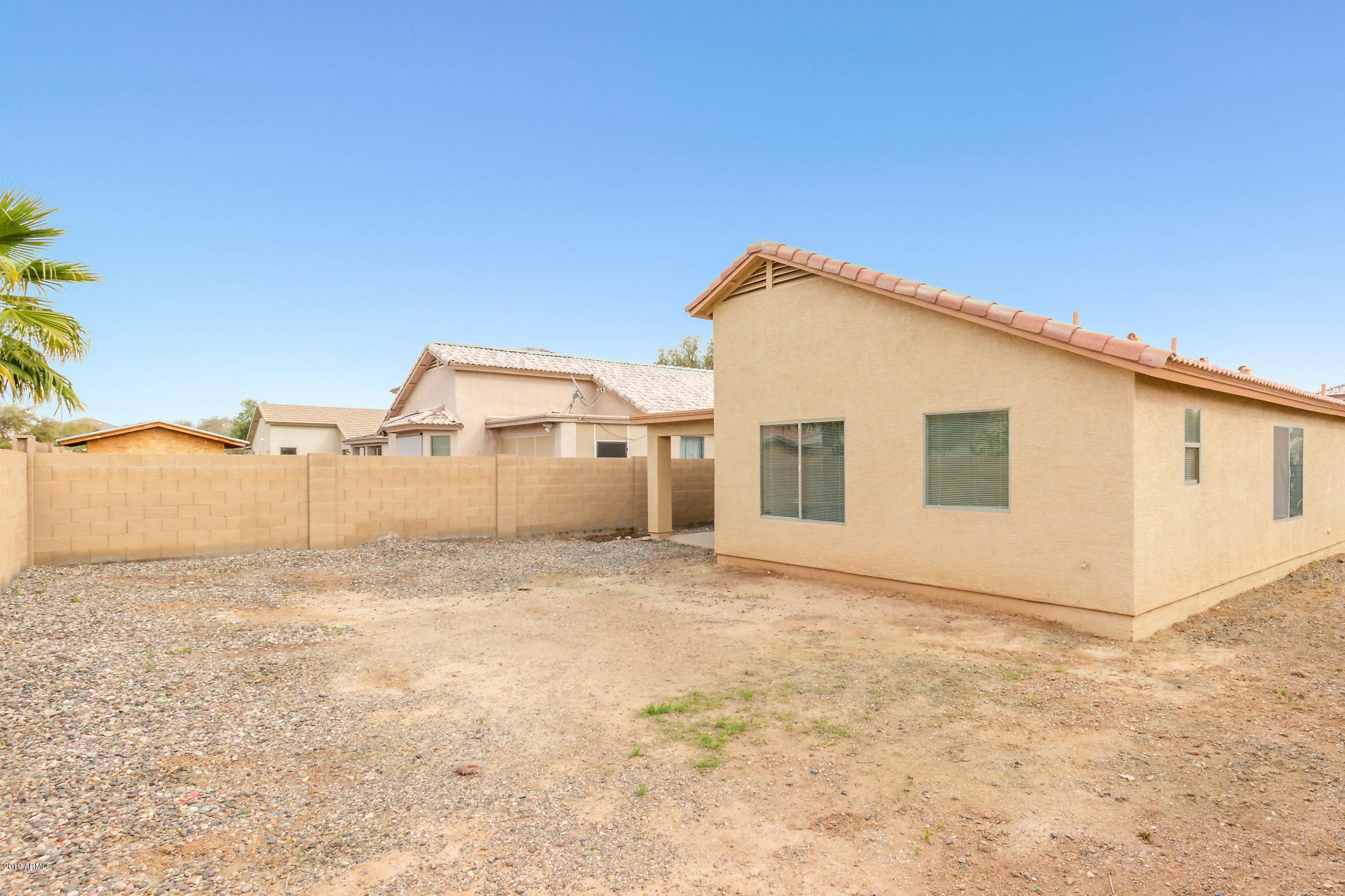 4332 West Maldonado Road Laveen, AZ 85339 - Photo 20 of 21 a view of a house with backyard