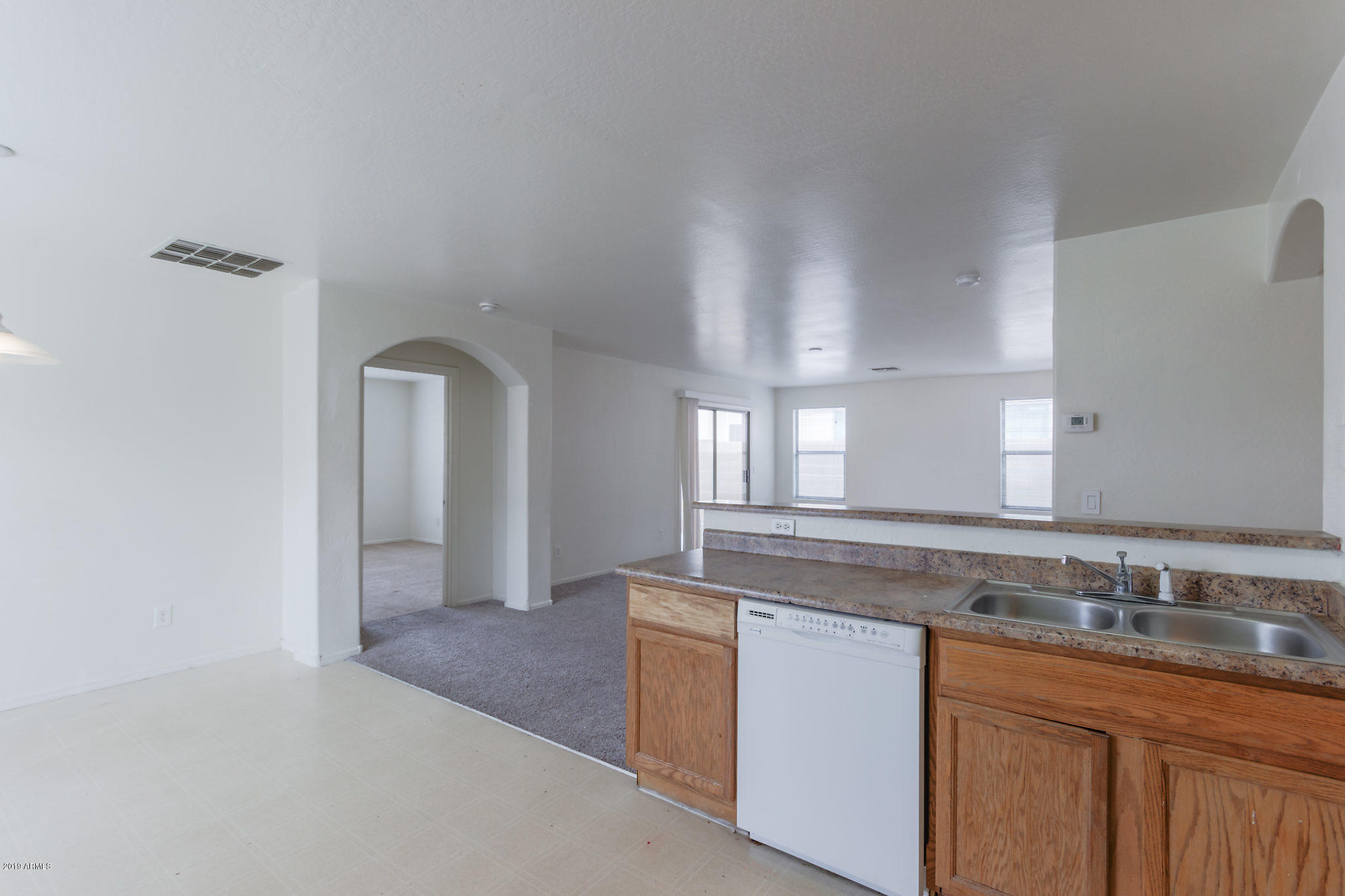 4332 West Maldonado Road Laveen, AZ 85339 - Photo 3 of 21 a spacious bathroom with a granite countertop sink and a mirror