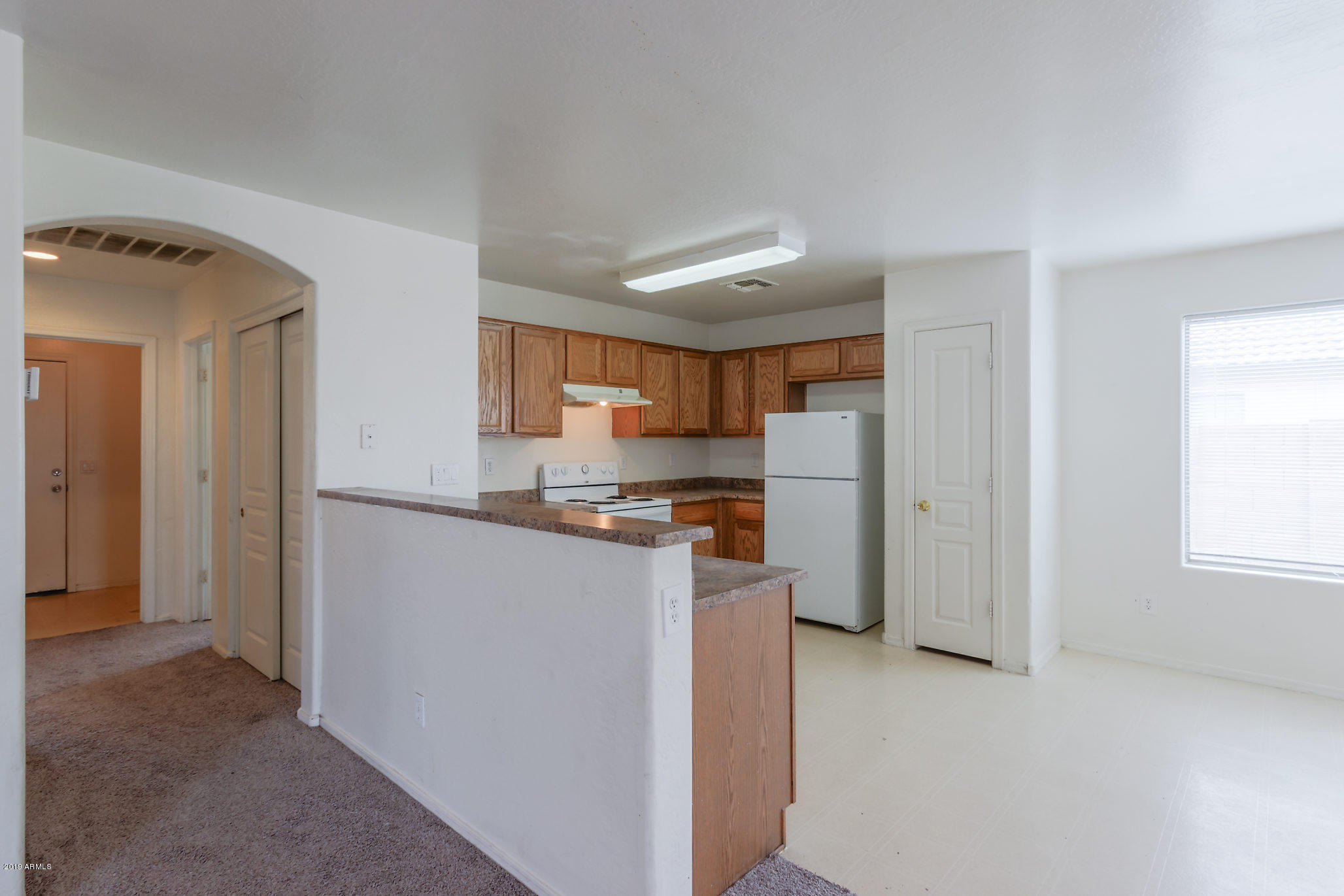 4332 West Maldonado Road Laveen, AZ 85339 - Photo 5 of 21 a kitchen with stainless steel appliances granite countertop a refrigerator and a stove top oven