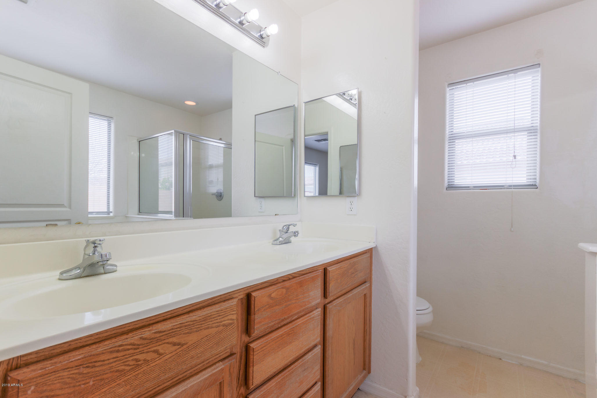 4332 West Maldonado Road Laveen, AZ 85339 - Photo 10 of 21 a bathroom with a sink and a mirror