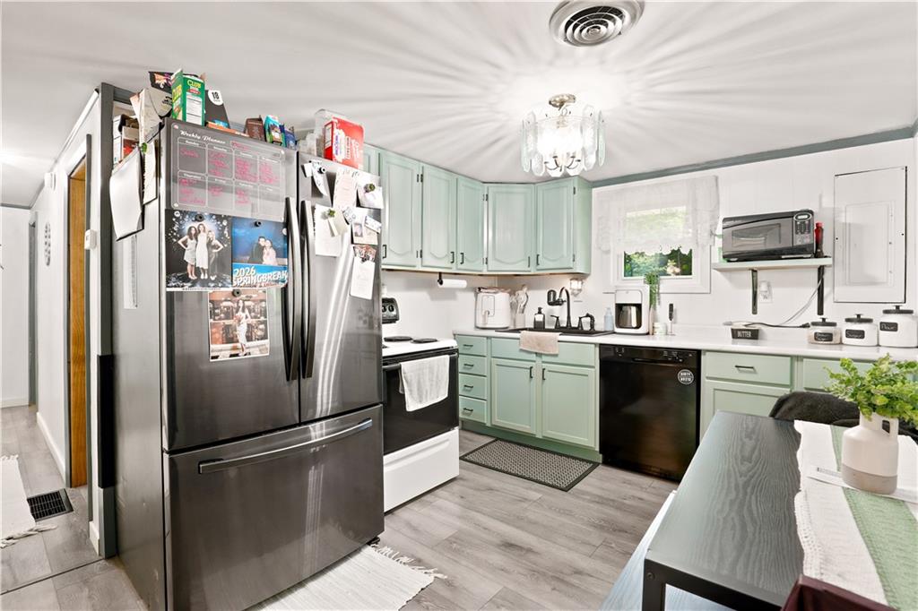 485 Scullton Road Rockwood, PA 15557 - Photo 8 of 27 a kitchen with granite countertop a refrigerator stove top oven and sink