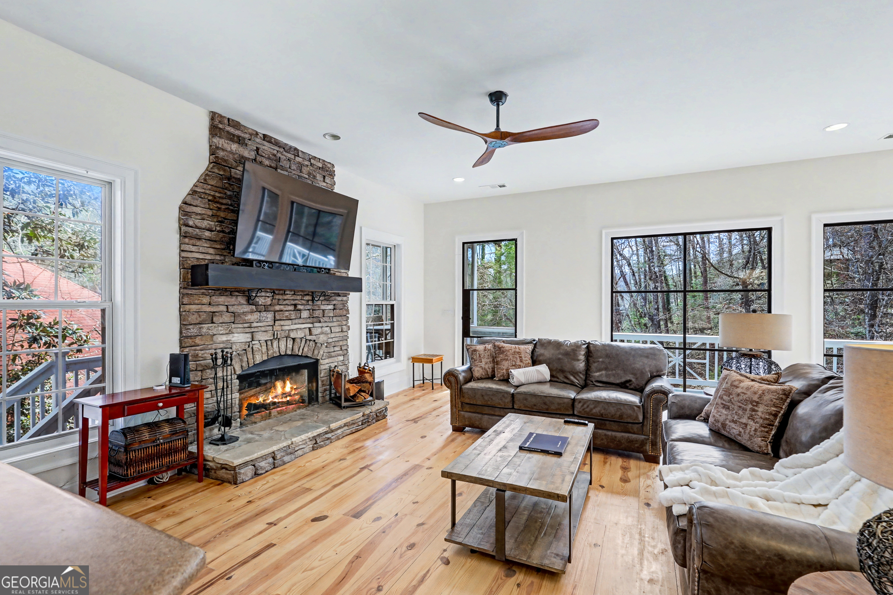 336 Fulton Road Tiger, GA 30576 - Photo 16 of 52 a living room with furniture and a fireplace