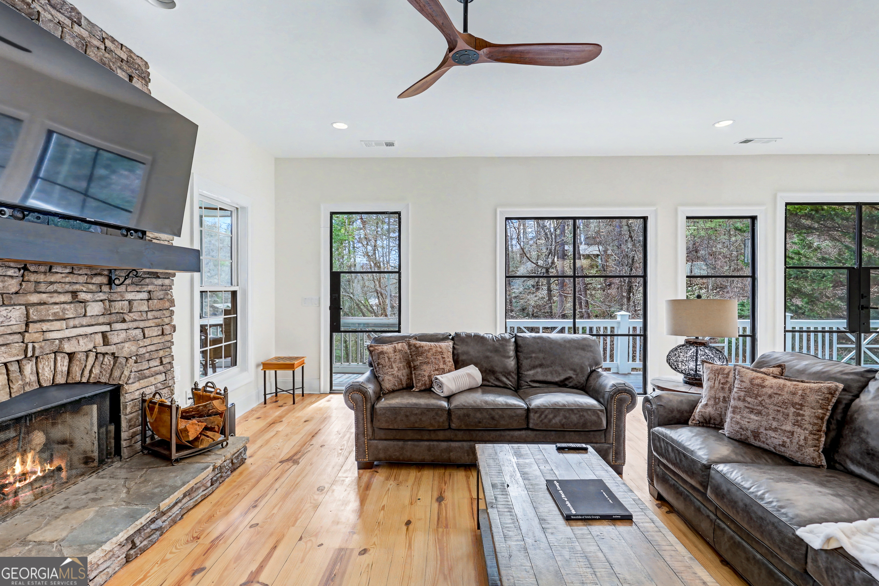 336 Fulton Road Tiger, GA 30576 - Photo 17 of 52 a living room with furniture and a fireplace