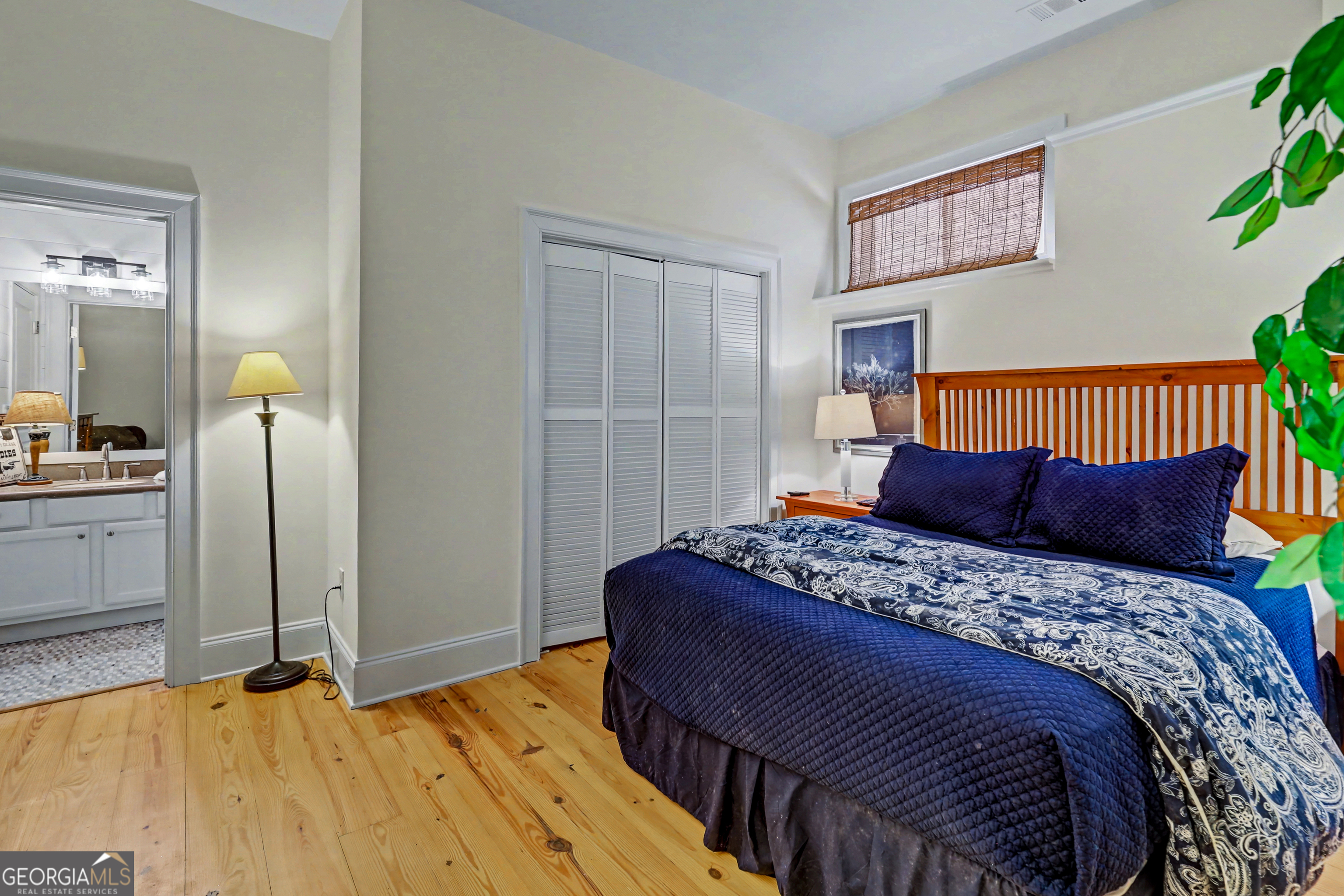 336 Fulton Road Tiger, GA 30576 - Photo 27 of 52 a bedroom with a bed and painting on the wall