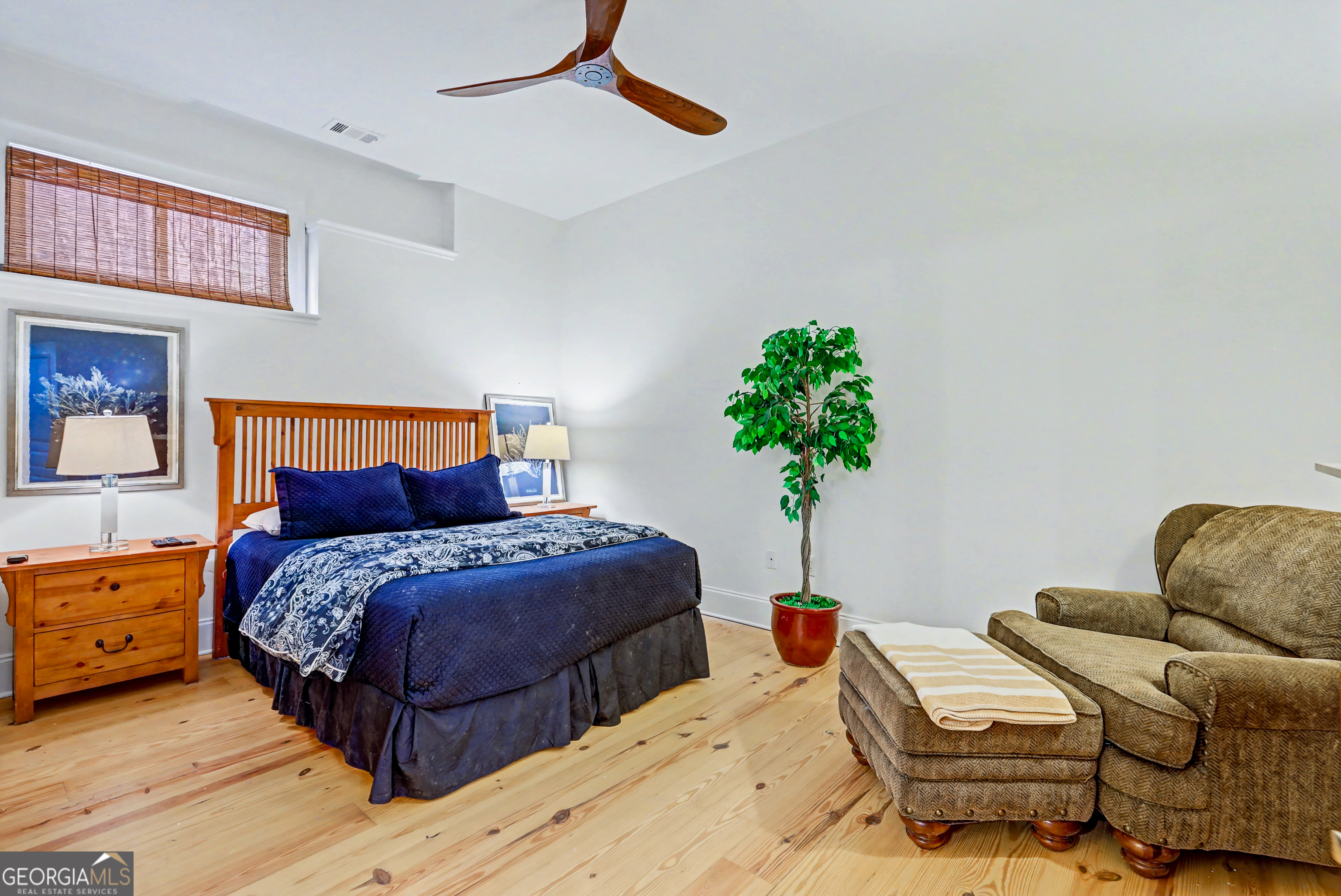 336 Fulton Road Tiger, GA 30576 - Photo 28 of 52 a bedroom with bed and a potted plant