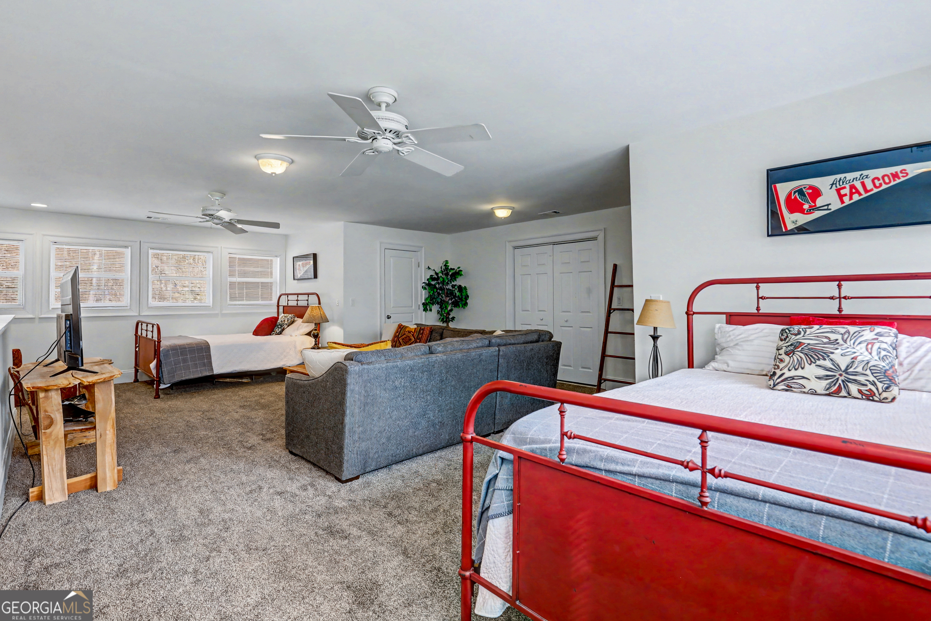 336 Fulton Road Tiger, GA 30576 - Photo 35 of 52 a bedroom with furniture and a chandelier
