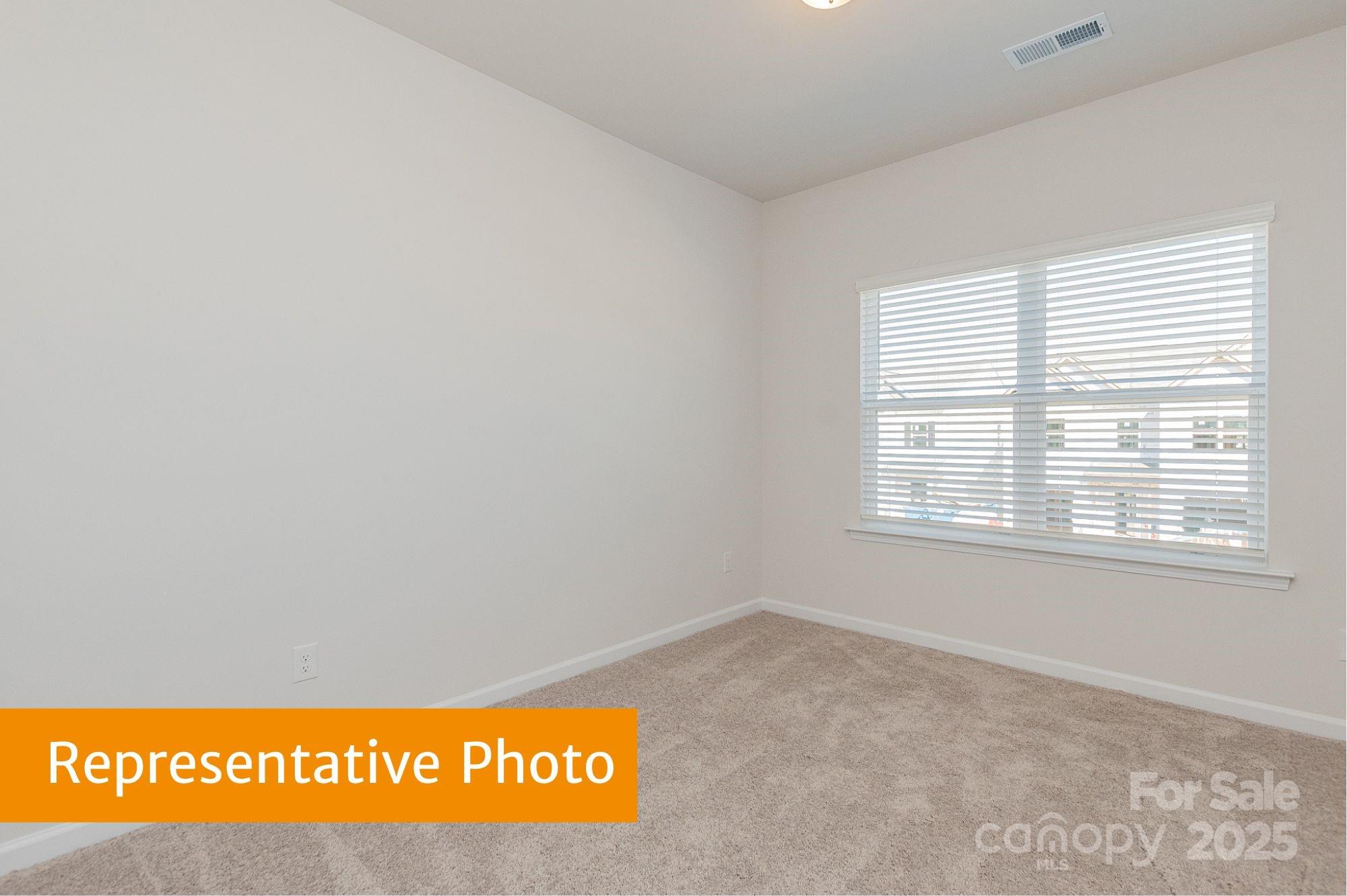 6028 Jasmine Br Road Charlotte, NC 28216 - Photo 22 of 29 a view of an empty room with a window