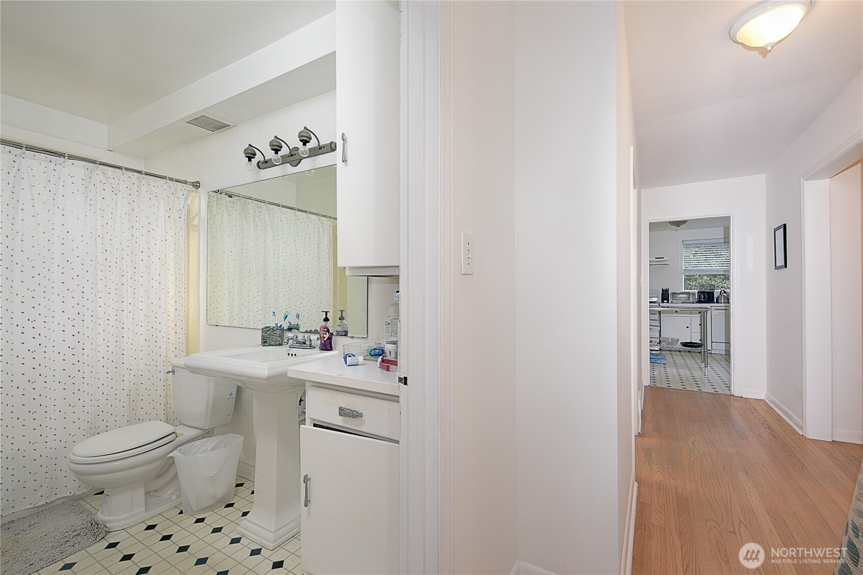910 East Prospect Street Seattle, WA 98102 - Photo 11 of 25 a bathroom with a sink a toilet and shower