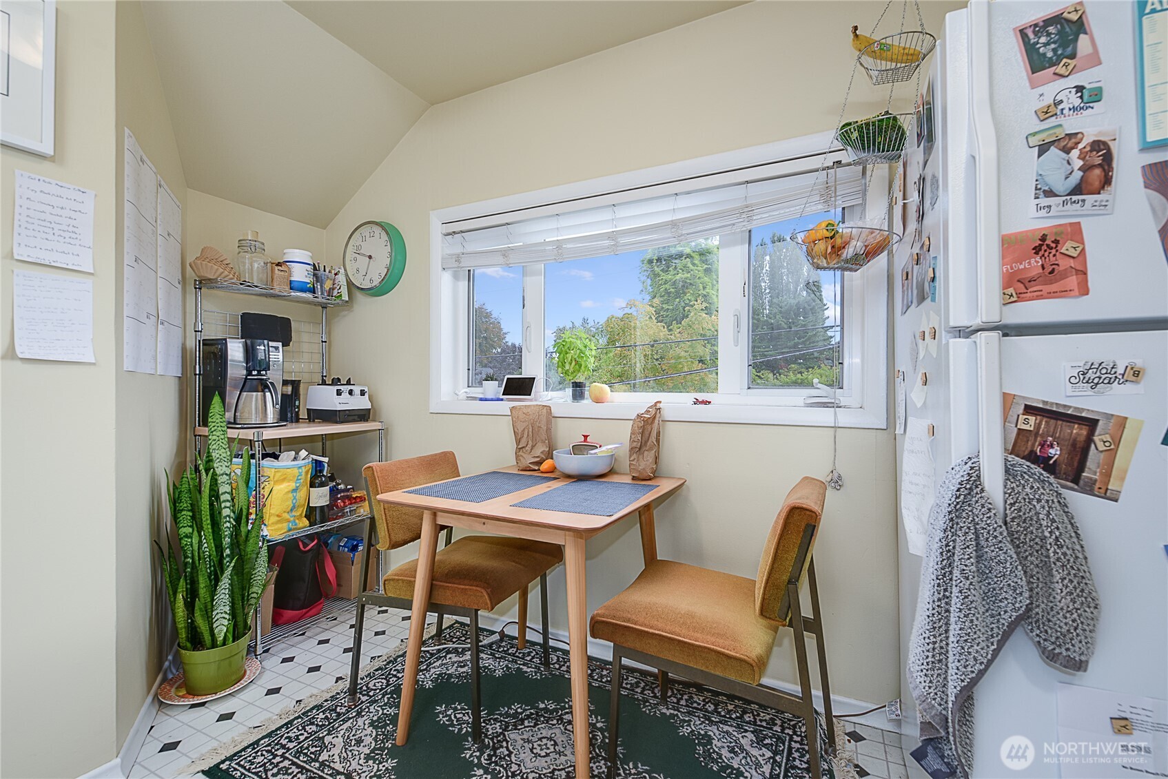 910 East Prospect Street Seattle, WA 98102 - Photo 18 of 25 a view of a dining room with furniture and a window