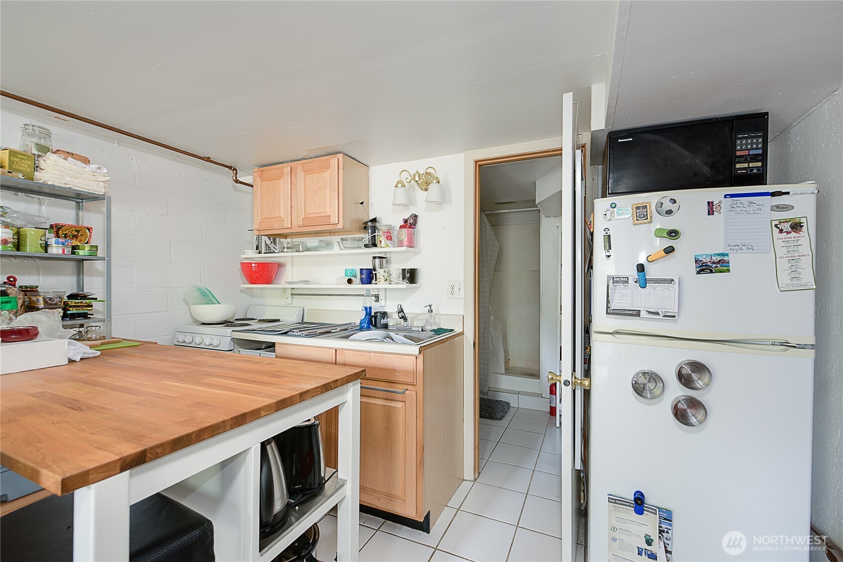 910 East Prospect Street Seattle, WA 98102 - Photo 5 of 25 a kitchen with stainless steel appliances a stove a refrigerator and a refrigerator