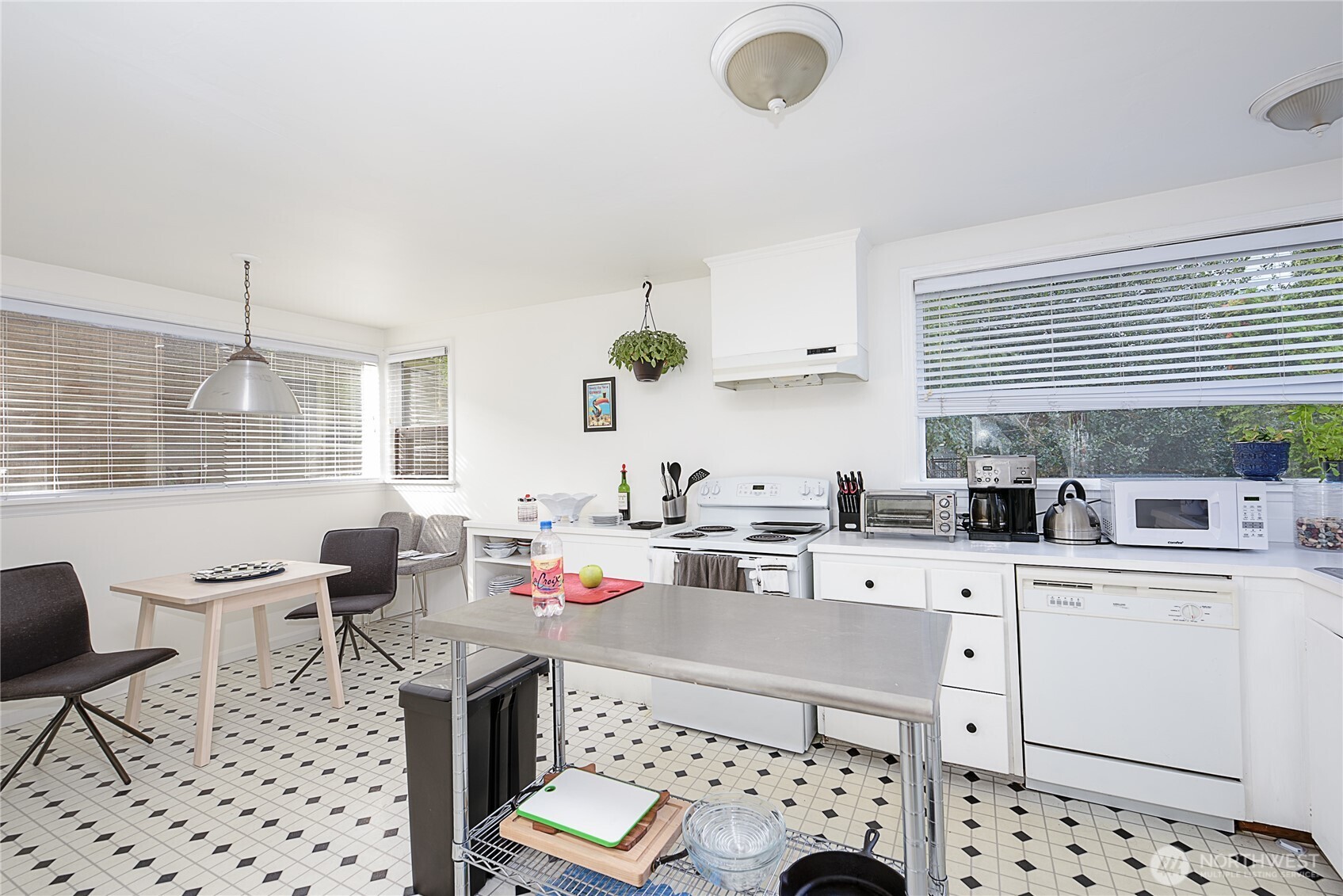 910 East Prospect Street Seattle, WA 98102 - Photo 6 of 25 a kitchen with granite countertop a sink and cabinets