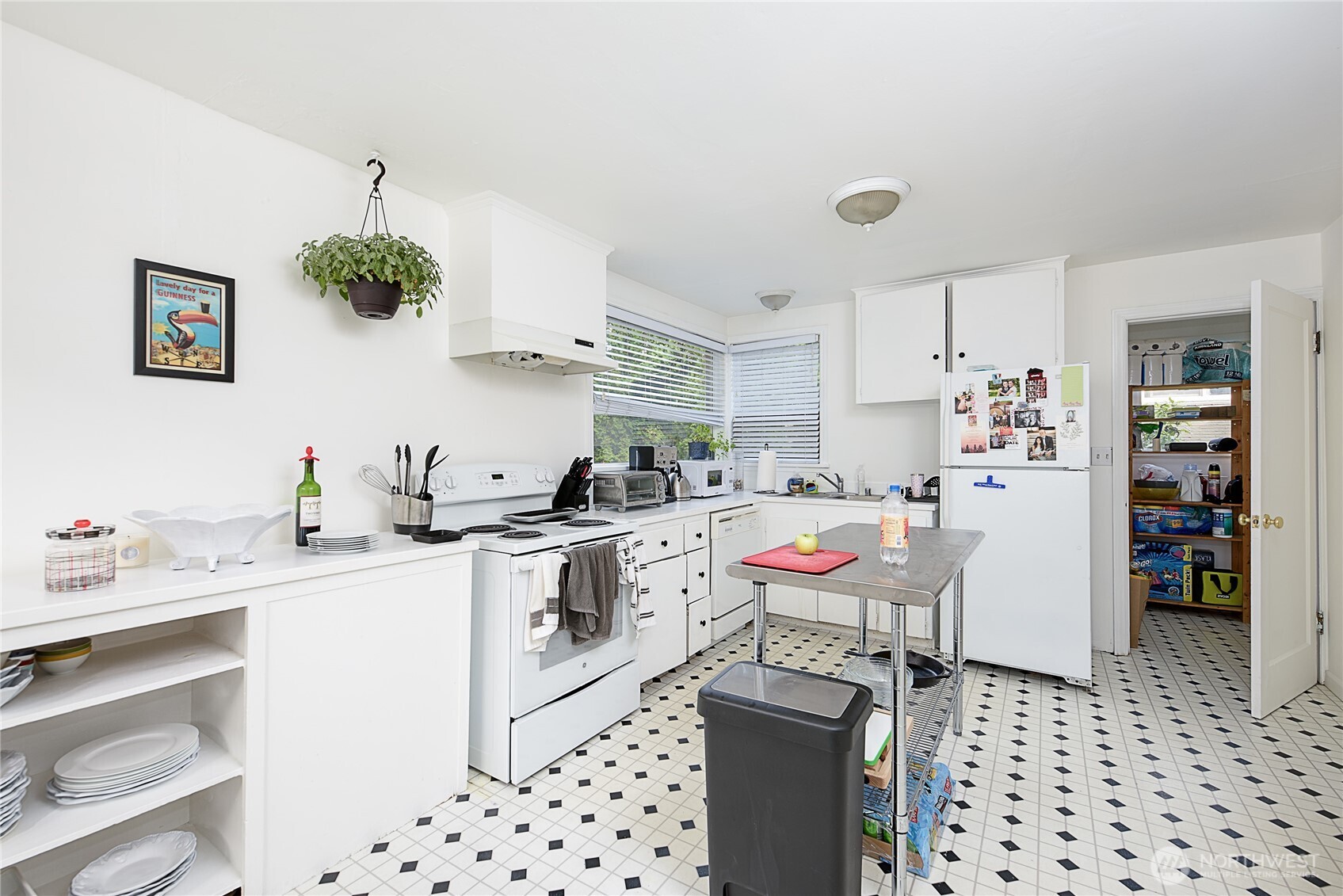 910 East Prospect Street Seattle, WA 98102 - Photo 7 of 25 a kitchen with a sink and cabinets