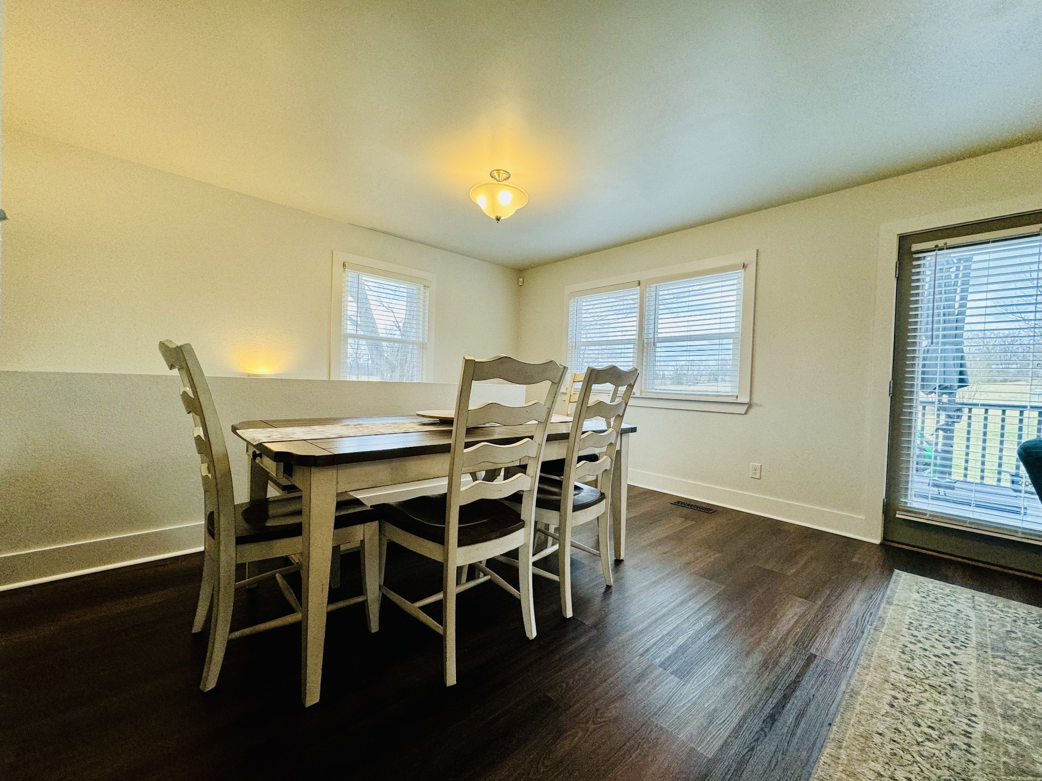 1175 Rock Church Road Dickson, TN 37055 - Photo 15 of 60 a view of a dining room with furniture and wooden floor